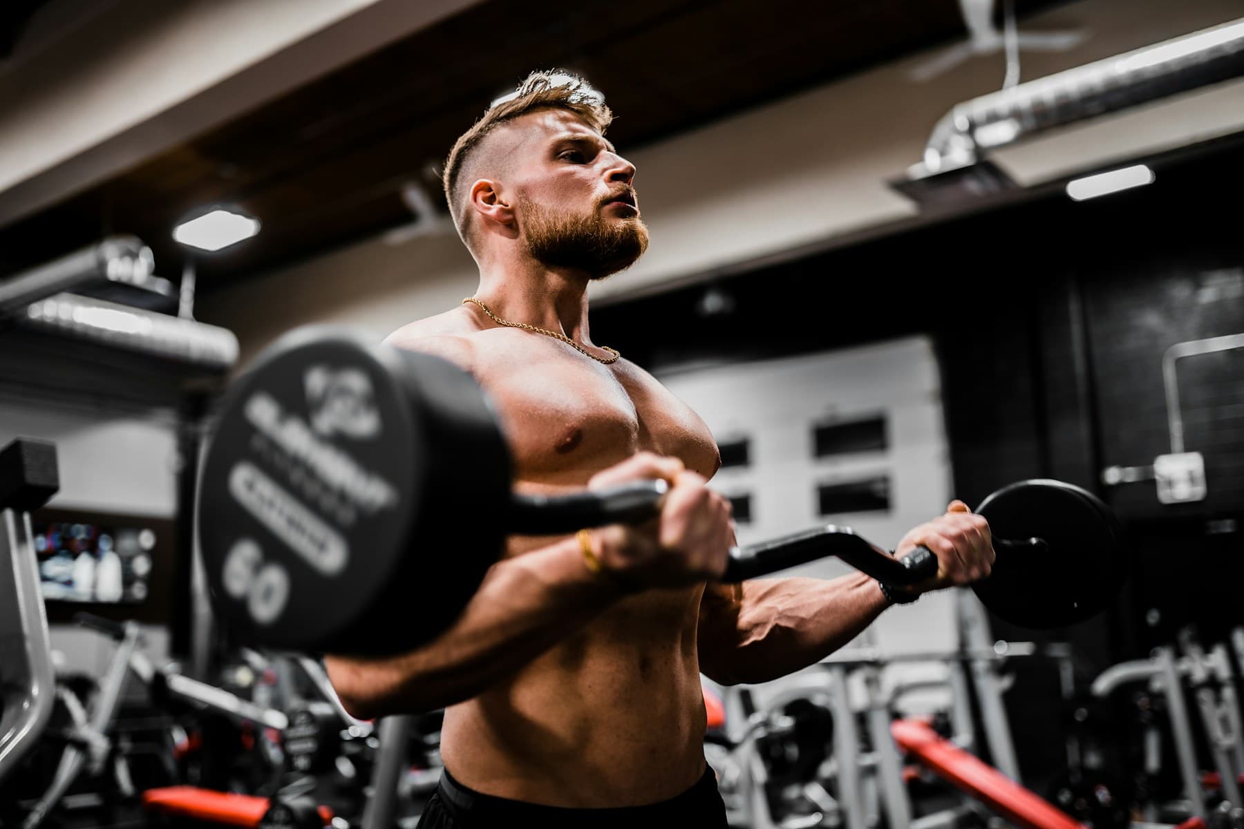 Adult strength training with dumbbells in a gym